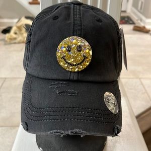 Ponytail baseball cap with really cool smiley face. Black